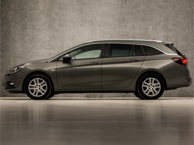 Opel ASTRA Sports Tourer 1.0 Sportline (APPLE CARPLAY, NAVIGATIE, GETINT GLAS, CHROOM PAKKET, XENON, SPORTSTOELEN, BLUETOOTH, CRUISE CONTROL, NIEUWSTAAT)