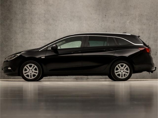 Opel ASTRA Sports Tourer 1.0 Online Edition (APPLE CARPLAY, NAVIGATIE, TREKHAAK, GETINT GLAS, CHROOM PAKKET, XENON, SPORTSTOELEN, BLUETOOTH, CRUISE CONTROL, NIEUWSTAAT)