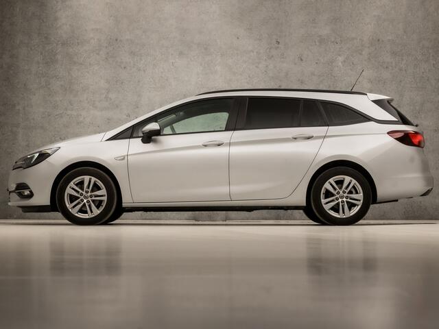 Opel ASTRA Sports Tourer 1.4 Sport 146Pk Automaat (APPLE CARPLAY, NAVIGATIE, CLIMATE, CAMERA, GETINT GLAS, SPORTSTOELEN, LM VELGEN, PARKEERSENSOREN, CRUISE, NIEUWSTAAT)