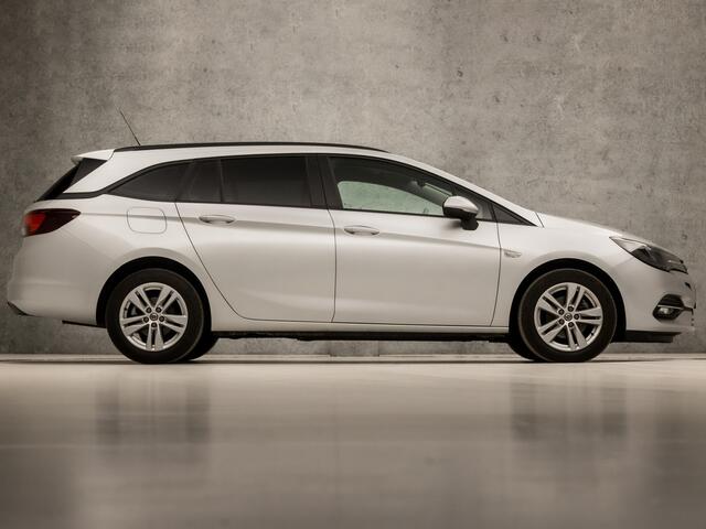 Opel ASTRA Sports Tourer 1.4 Sport 146Pk Automaat (APPLE CARPLAY, NAVIGATIE, CLIMATE, CAMERA, GETINT GLAS, SPORTSTOELEN, LM VELGEN, PARKEERSENSOREN, CRUISE, NIEUWSTAAT)