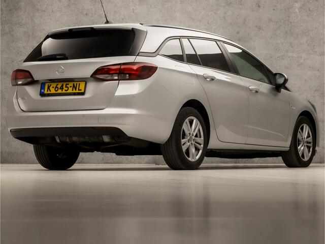 Opel ASTRA Sports Tourer 1.4 Sport 146Pk Automaat (APPLE CARPLAY, NAVIGATIE, CLIMATE, CAMERA, GETINT GLAS, SPORTSTOELEN, LM VELGEN, PARKEERSENSOREN, CRUISE, NIEUWSTAAT)