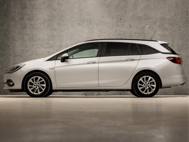 Opel ASTRA Sports Tourer 1.4 Sport 146Pk Automaat (APPLE CARPLAY, NAVIGATIE, CAMERA, CLIMATE, GETINT GLAS, SPORTSTOELEN, PARKEERSENSOREN, LM VELGEN, NIEUWE APK, NIEUWSTAAT)