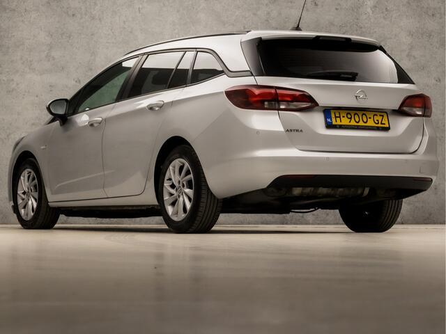 Opel ASTRA Sports Tourer 1.4 Sport 146Pk Automaat (APPLE CARPLAY, NAVIGATIE, CAMERA, CLIMATE, GETINT GLAS, SPORTSTOELEN, PARKEERSENSOREN, LM VELGEN, NIEUWE APK, NIEUWSTAAT)