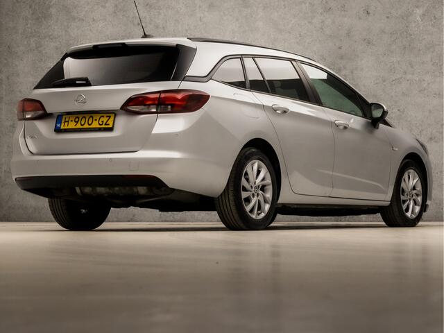 Opel ASTRA Sports Tourer 1.4 Sport 146Pk Automaat (APPLE CARPLAY, NAVIGATIE, CAMERA, CLIMATE, GETINT GLAS, SPORTSTOELEN, PARKEERSENSOREN, LM VELGEN, NIEUWE APK, NIEUWSTAAT)
