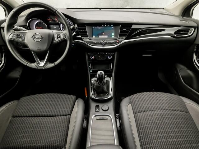 Opel ASTRA Sports Tourer 1.2 Elegance (APPLE CARPLAY, NAVIGATIE, CLIMATE, CAMERA, ADAPTIVE CRUISE, LEDER, SPORTSTOELEN, GETINT GLAS, LM VELGEN, NIEUWSTAAT)