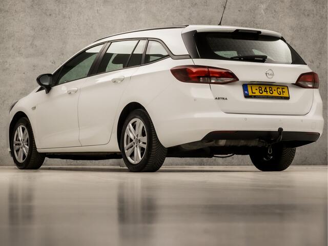 Opel ASTRA Sports Tourer 1.2 Edition (APPLE CARPLAY, LM VELGEN, DAB+, SPORTSTOELEN, PARKEERSENSOREN, CRUISE, TREKHAAK, NIEUWSTAAT)