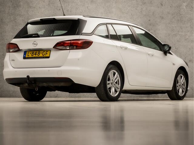 Opel ASTRA Sports Tourer 1.2 Edition (APPLE CARPLAY, LM VELGEN, DAB+, SPORTSTOELEN, PARKEERSENSOREN, CRUISE, TREKHAAK, NIEUWSTAAT)