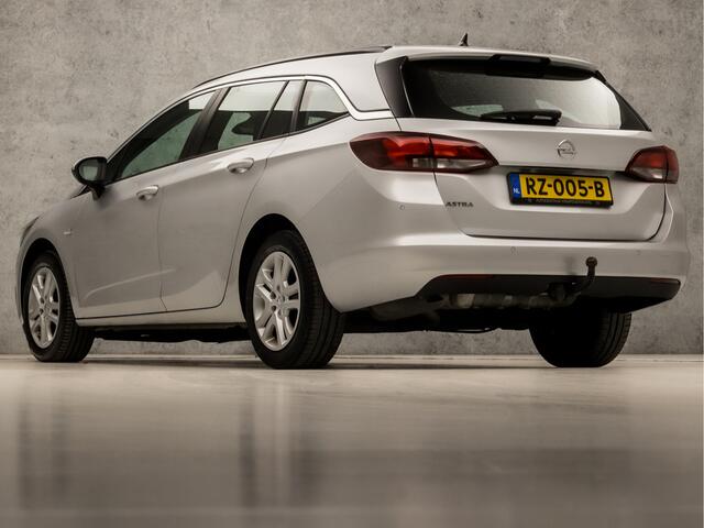 Opel ASTRA Sports Tourer 1.0 Sport+ (APPLE CARPLAY, GROOT NAVI, CRUISE, SPORTSTOELEN, PARKEERSENSOREN, DAB+, TREKHAAK, ELEK PAKKET, NIEUWE APK, NIEUWSTAAT)