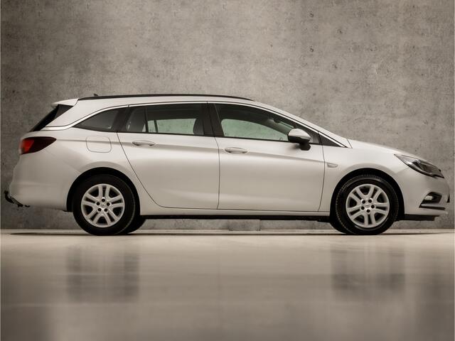 Opel ASTRA Sports Tourer 1.0 Sport+ (APPLE CARPLAY, GROOT NAVI, CRUISE, SPORTSTOELEN, PARKEERSENSOREN, DAB+, TREKHAAK, ELEK PAKKET, NIEUWE APK, NIEUWSTAAT)