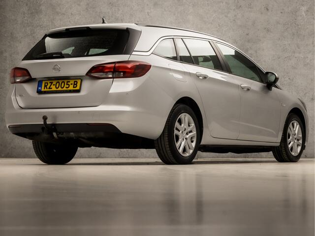 Opel ASTRA Sports Tourer 1.0 Sport+ (APPLE CARPLAY, GROOT NAVI, CRUISE, SPORTSTOELEN, PARKEERSENSOREN, DAB+, TREKHAAK, ELEK PAKKET, NIEUWE APK, NIEUWSTAAT)