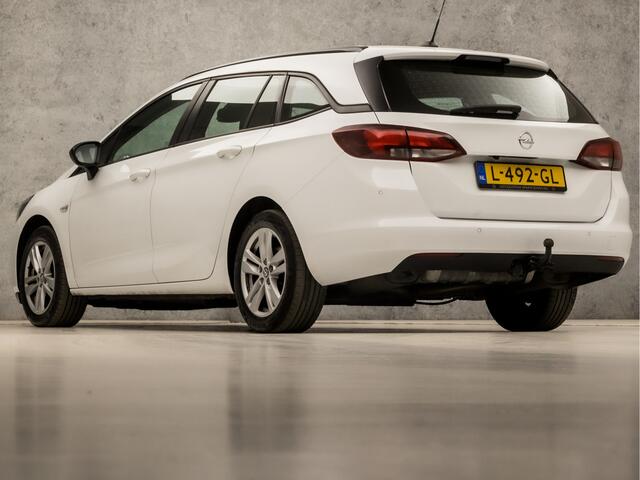 Opel ASTRA Sports Tourer 1.4 Turbo Sport 146Pk Automaat (APPLE CARPLAY, NAVIGATIE, CAMERA, CRUISE, PARKEERSENSOREN, SPORTSTOELEN, LED KOPLAMPEN, TREKHAAK, NIEUWE APK, NIEUWSTAAT)
