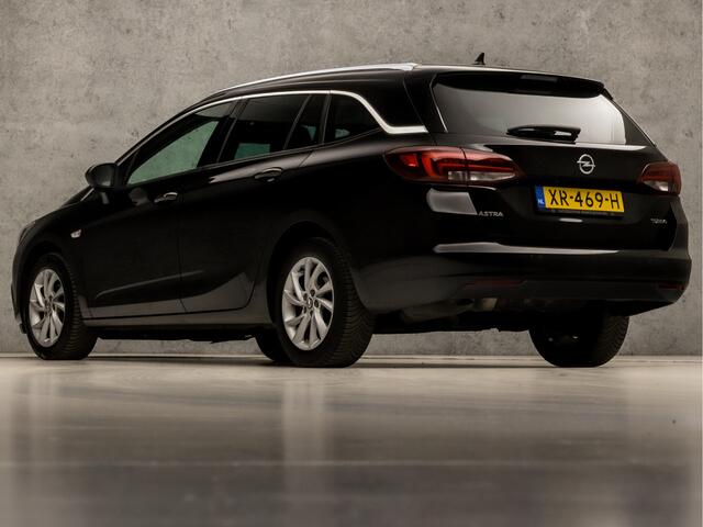 Opel ASTRA Sports Tourer 1.4 Innovation 150Pk (APPLE CARPLAY, GROOT NAVI, CLIMATE, CAMERA, GETINT GLAS, LEDER, SPORTSTOELEN, KEYLESS, LED KOPLAMPEN, LANE ASSIST, NIEUWSTAAT)