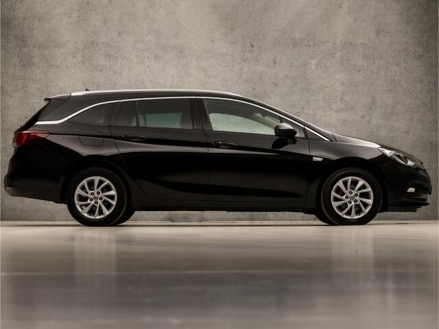 Opel ASTRA Sports Tourer 1.4 Innovation 150Pk (APPLE CARPLAY, GROOT NAVI, CLIMATE, CAMERA, GETINT GLAS, LEDER, SPORTSTOELEN, KEYLESS, LED KOPLAMPEN, LANE ASSIST, NIEUWSTAAT)