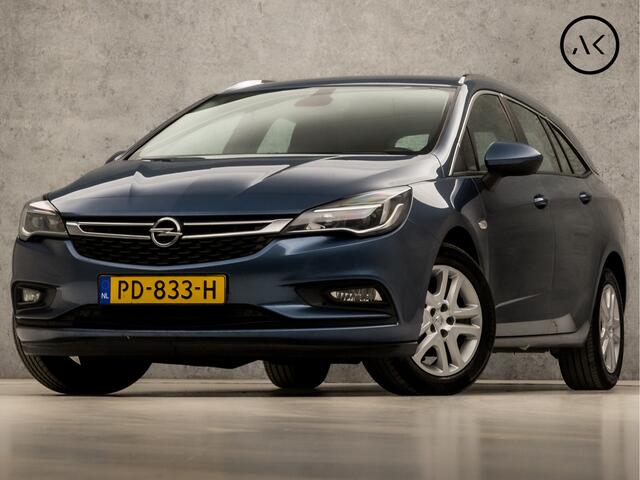 Opel ASTRA Sports Tourer 1.4 Sport 150Pk (APPLE CARPLAY, GROOT NAVI, CLIMATE, STUUR/STOELVERWARMING, SPORTSTOELEN, CAMERA, TREKHAAK, PARKEERSENSOREN, NIEUWSTAAT)