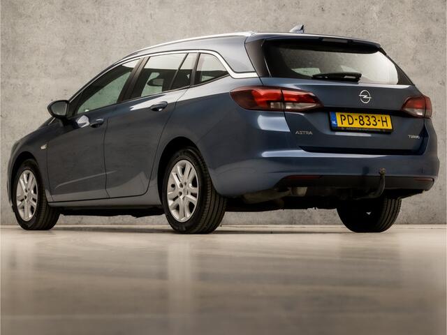 Opel ASTRA Sports Tourer 1.4 Sport 150Pk (APPLE CARPLAY, GROOT NAVI, CLIMATE, STUUR/STOELVERWARMING, SPORTSTOELEN, CAMERA, TREKHAAK, PARKEERSENSOREN, NIEUWSTAAT)