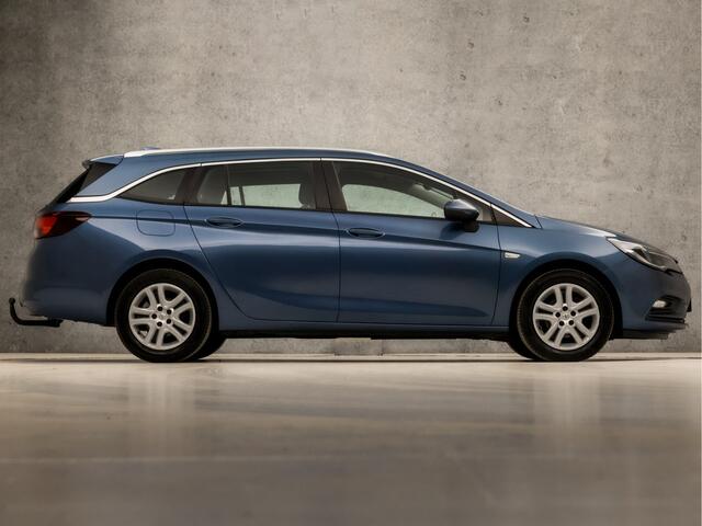 Opel ASTRA Sports Tourer 1.4 Sport 150Pk (APPLE CARPLAY, GROOT NAVI, CLIMATE, STUUR/STOELVERWARMING, SPORTSTOELEN, CAMERA, TREKHAAK, PARKEERSENSOREN, NIEUWSTAAT)