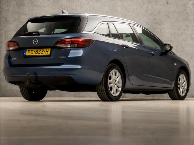 Opel ASTRA Sports Tourer 1.4 Sport 150Pk (APPLE CARPLAY, GROOT NAVI, CLIMATE, STUUR/STOELVERWARMING, SPORTSTOELEN, CAMERA, TREKHAAK, PARKEERSENSOREN, NIEUWSTAAT)