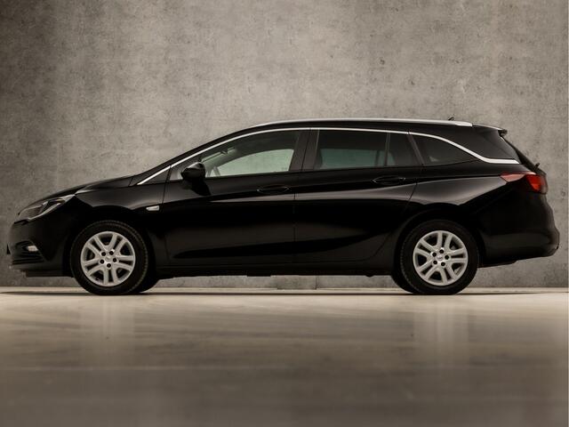 Opel ASTRA Sports Tourer 1.0 Turbo Sport (APPLE CARPLAY, GROOT NAVI, CLIMATE, SPORTSTOELEN, LEDER, PARKEERSENSOREN, GETINT GLAS, LM VELGEN, NIEUWSTAAT)