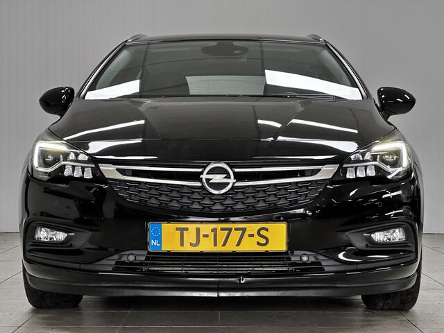Opel ASTRA Sports Tourer 1.0 Innovation/ Half-Leder/ LED Koplampen/ Keyless/ Apple + Android/ Lane-Assist./ DAB+/ Grootlicht Assist./ 16'' LMV/ Navi/ Clima/ Cruise/ Bluetooth/ Multi. LEDER. Stuur/ PDC V+A.