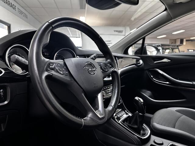 Opel ASTRA Sports Tourer 1.0 Innovation/ Half-Leder/ LED Koplampen/ Keyless/ Apple + Android/ Lane-Assist./ DAB+/ Grootlicht Assist./ 16'' LMV/ Navi/ Clima/ Cruise/ Bluetooth/ Multi. LEDER. Stuur/ PDC V+A.