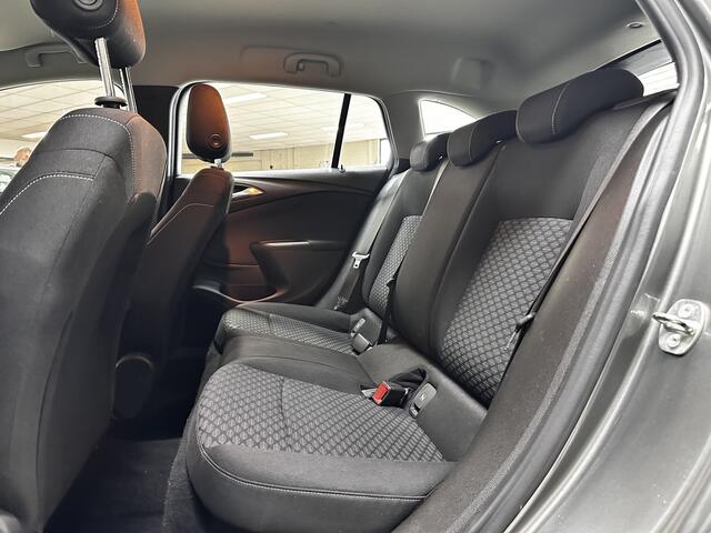 Opel ASTRA Sports Tourer 1.0 Online Edition/ PDC V+A/ Apple + Android/ DAB+/ Navi/ Airco/ Cruise/ Elek. pakket/ Isofix/ Bluetooth/ Armsteun/ Multi. LEDER. Stuur/ LED Dagrijverl.