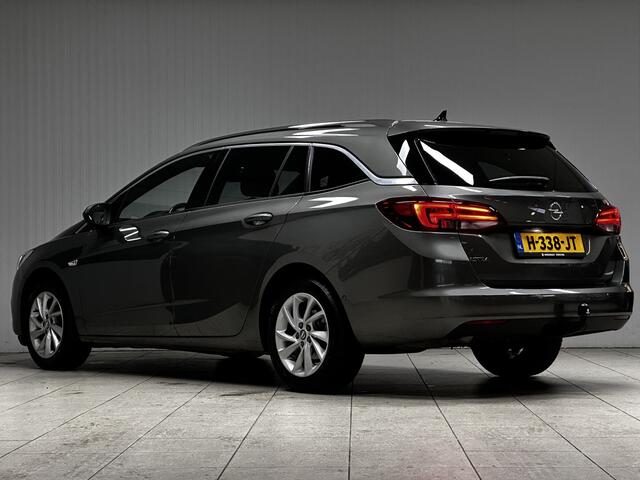 Opel ASTRA Sports Tourer 1.2 Elegance/ Trekhaak!/ LED Koplampen/ Virtual Cockpit/ Dodehoekdetectie/ Camera/ Zwarte Hemel/ Grootlichtass./ Keyless/ DAB+/ Apple+Android/ Clima/ Navi/ Cruise/ Bluetooth/ Multi.LEDER.Stuur/ Elek.Pakket