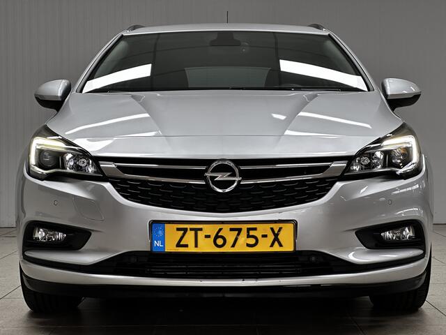 Opel ASTRA Sports Tourer 1.0 Turbo 120 Jaar Edition /Apple + Android /DAB+! /Navi /Climat /Cruise /Elek. pakket /Bluetooth /Regensensor /16"LMV /Extra getint glas /PDC V+A /LED Dagrijverl. /Dakrails.