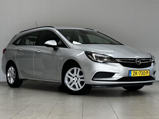 Opel ASTRA Sports Tourer 1.0 Turbo Business/ Apple + Android/ DAB+/ Navi/ Airco/ Cruise/ Elek. pakket/ Isofix/ Bluetooth/ Armsteun/ Multi. LEDER. Stuur/ PDC Achter.