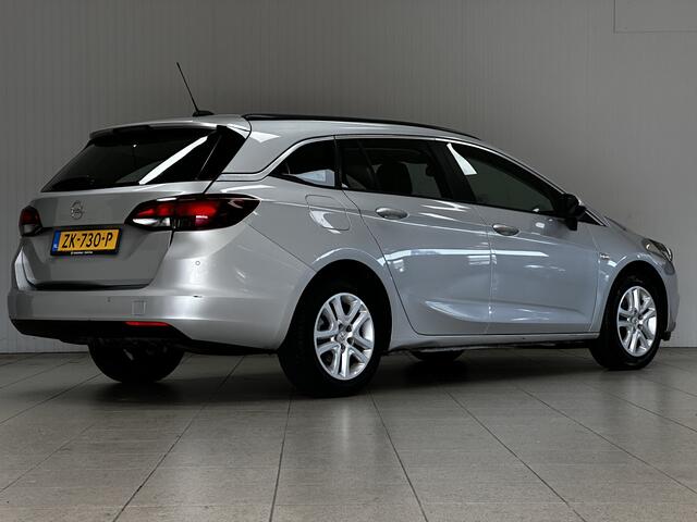 Opel ASTRA Sports Tourer 1.0 Turbo Business/ Apple + Android/ DAB+/ Navi/ Airco/ Cruise/ Elek. pakket/ Isofix/ Bluetooth/ Armsteun/ Multi. LEDER. Stuur/ PDC Achter.