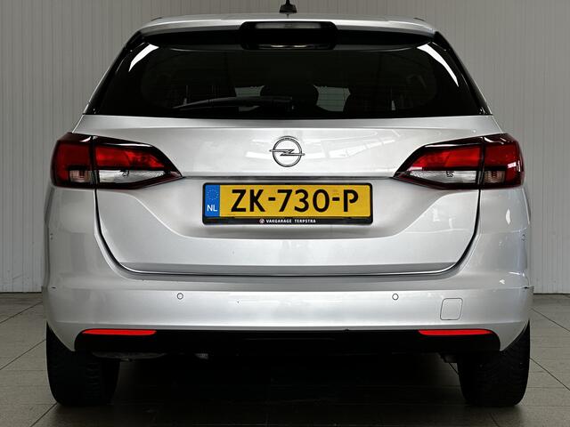 Opel ASTRA Sports Tourer 1.0 Turbo Business/ Apple + Android/ DAB+/ Navi/ Airco/ Cruise/ Elek. pakket/ Isofix/ Bluetooth/ Armsteun/ Multi. LEDER. Stuur/ PDC Achter.