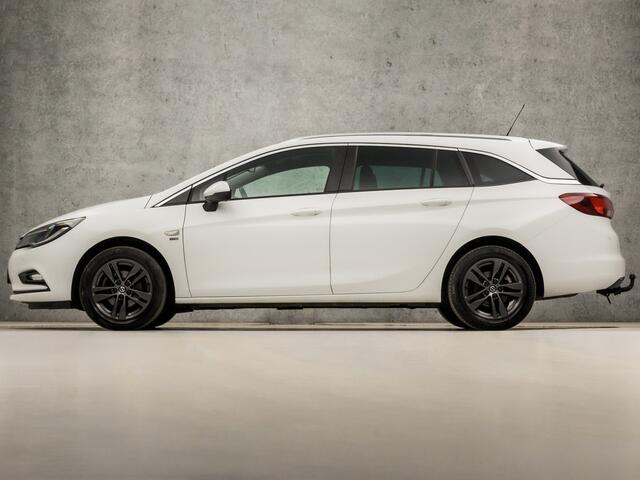 Opel ASTRA Sports Tourer 1.0 Turbo 120 Jaar Edition (APPLE CARPLAY, NAVIGATIE, CLIMATE, LED KOPLAMPEN, SPORTSTOELEN, CRUISE, PARKEERSENSOREN, GETINT GLAS, LM VELGEN, NIEUWSTAAT)