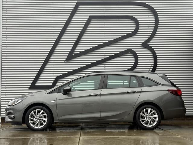 Opel ASTRA Sports Tourer 1.2 Business Edition 2e Eigenaar,Apple Carplay,Airco,Camera,Cruise,PDC,Trekhaak,N.A.P,APK tot 07-2026