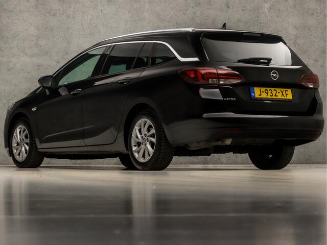 Opel ASTRA Sports Tourer 1.2 Elegance Sport (APPLE CARPLAY, GROOT NAVI, MATRIX LED KOPLAMPEN, KEYLESS, CAMERA, ADAPTIVE CRUISE, GETINT GLAS, LM VELGEN, NIEUWSTAAT)