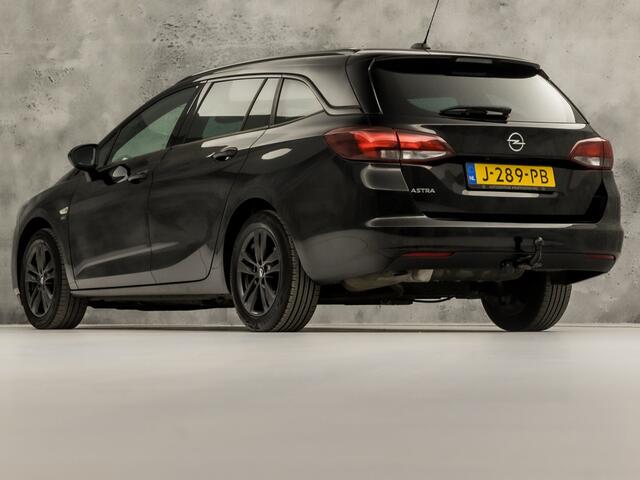 Opel ASTRA Sports Tourer 1.2 Sport (APPLE CARPLAY, CAMERA, CLIMATE, ZWART HEMEL, ADAPTIVE CRUISE, SPORTSTOELEN, GETINT GLAS, TREKHAAK, NIEUWSTAAT)