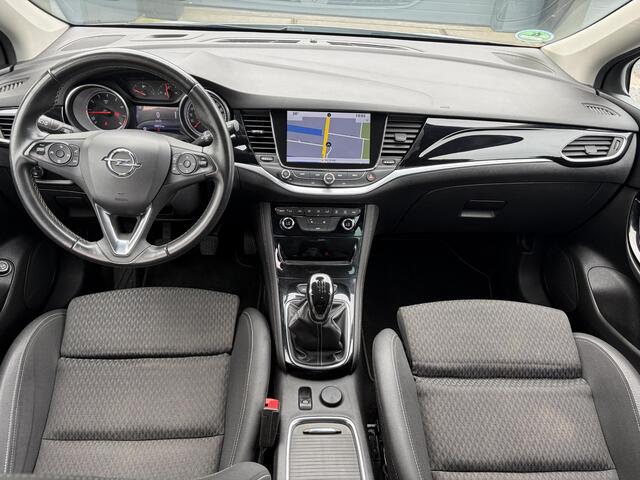 Opel ASTRA Sports Tourer 1.4 Innovation 2e Eigenaar,150pk,Carplay,Clima,Cruise,6 Bak,Keyless,Halfleder,Comfortstoelen,Rijstrooksensor,Elekt.Stoelen,Lm velgen,PDC V+A,N.A.P,Nieuwe Apk bij Aflevering