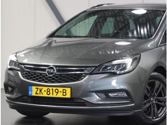 Opel ASTRA ST 105PK 120 Jaar Edition | 1ste eigenaar | Camera | Trekhaak | AppleCarPlay/Android | Armsteun | AGR stoelen | Navigatie | Climate Control | Cruise Control | Isofix | Privacy Glass | Parkeersensoren |