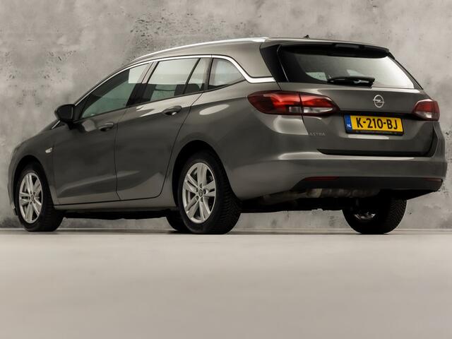 Opel ASTRA Sports Tourer 1.4 Turbo Innovation Sport 150Pk Automaat (APPLE CARPLAY, NAVIGATIE, CAMERA, STUUR/STOELVERWARMING, SPORTSTOELEN, ADAPTIVE CRUISE, LM VELGEN, NIEUWSTAAT)