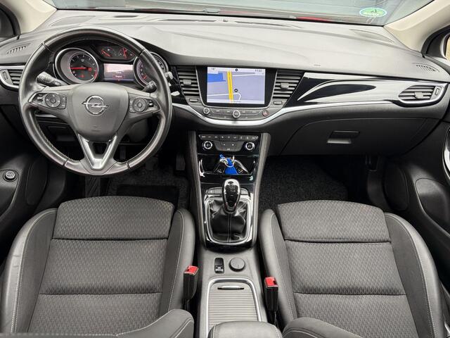 Opel ASTRA Sports Tourer 1.4 Innovation Dealer Onderhouden l 150pk l Carplay l 2e Eigenaar l Camera l Trekhaak l Keyless l Navi l Halfleder l Pdc V+A l 6 Bak l Clima l Cruise l Rijstrooksensor l Dodehoeksensor l N.A.P l Apk tot 01-2027