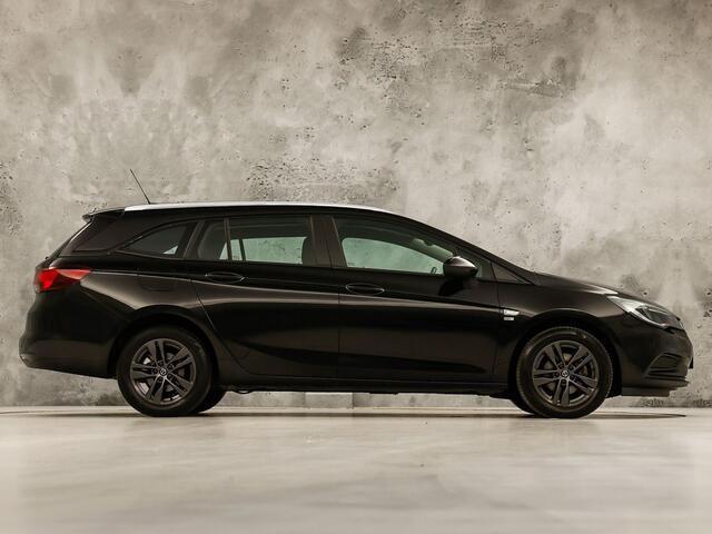 Opel ASTRA Sports Tourer 1.0 Turbo 120 Jaar Edition (APPLE CARPLAY, NAVIGATIE, LM VELGEN, PARKEERSENSOREN, SPORTSTOELEN, CRUISE, NIEUWE APK, NIEUWSTAAT)