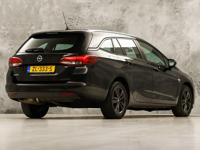Opel ASTRA Sports Tourer 1.0 Turbo 120 Jaar Edition (APPLE CARPLAY, NAVIGATIE, LM VELGEN, PARKEERSENSOREN, SPORTSTOELEN, CRUISE, NIEUWE APK, NIEUWSTAAT)