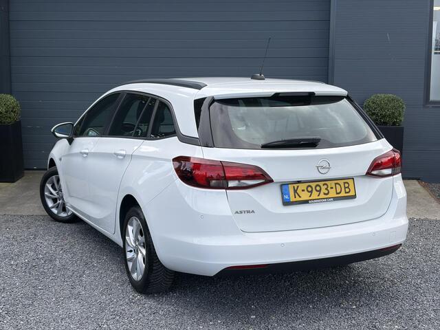 Opel ASTRA Sports Tourer 1.2 Edition ?Camera ?110pk?2e Eigenaar?Carplay?Navi?Airco?Cruise?Pdc?LED koplampen?N.A.P.?6 Bak?Pdc V+A?Lm velgen?Dakdragers ?Comfortstoelen?Bj 11-2020?Apk tot 07-2028