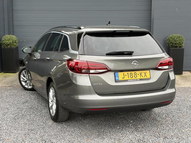 Opel ASTRA Sports Tourer 1.2 Elegance ?131pk?2e Eigenaar?Camera?Carplay?6 Bak?Stoelverw?Stuurverw?Pdc V+A?Recent beurt gehad?Clima?Cruise?Halfleder?Keyless?N.A.P?Lm velgen?Rijstrooksensor?Apk tot 09-2028