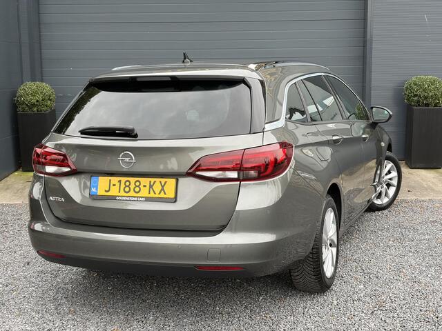 Opel ASTRA Sports Tourer 1.2 Elegance ?131pk?2e Eigenaar?Camera?Carplay?6 Bak?Stoelverw?Stuurverw?Pdc V+A?Recent beurt gehad?Clima?Cruise?Halfleder?Keyless?N.A.P?Lm velgen?Rijstrooksensor?Apk tot 09-2028