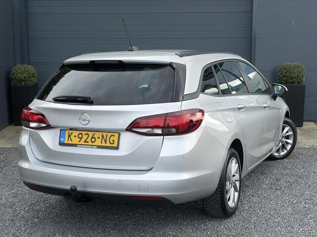 Opel ASTRA Sports Tourer 1.2 Business Executive ?1e Eigenaar?146pk?Camera?Trekhaak?Carplay?Airco?Cruise?Pdc V+A?Lm velgen?Comfortstoelen?6 Bak?N.A.P?Nieuwe Apk bij Aflevering
