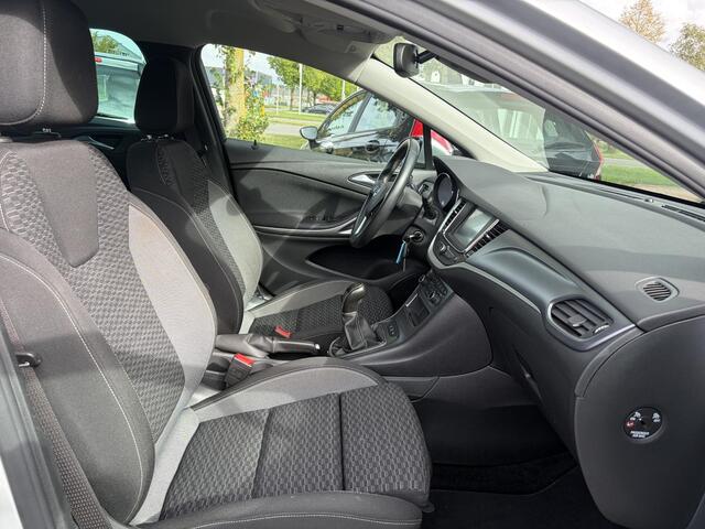 Opel ASTRA Sports Tourer 1.2 Business Executive ?1e Eigenaar?146pk?Camera?Trekhaak?Carplay?Airco?Cruise?Pdc V+A?Lm velgen?Comfortstoelen?6 Bak?N.A.P?Nieuwe Apk bij Aflevering