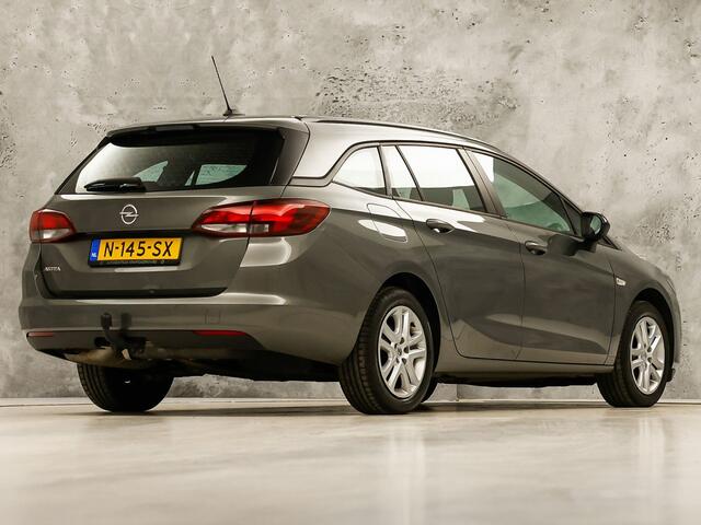 Opel ASTRA Sports Tourer 1.2 Sport (APPLE CARPLAY, NAVIGATIE, CRUISE, TREKHAAK, SPORTSTOELEN, PARKEERSENSOREN, NIEUWSTAAT)