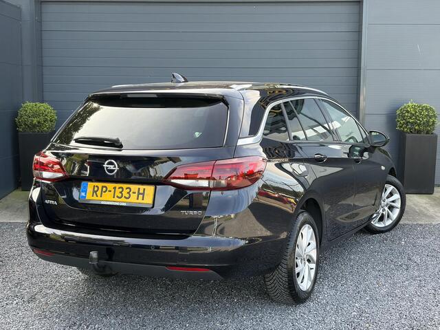 Opel ASTRA Sports Tourer 1.4 Business Executive ?2 Eigenaar?Camera?Navi?Trekhaakt?Carplay?Stoelverw?Stuurverw?Automaat?Dealer Onderhouden?Keyless?Clima?Cruise?Pdc V+A?Halfleder?Comfortstoelen?150pk?Rijstrooksensor?Dodehoeksensor?Elekt Stoelen?Lm velgen?N.A.P?Apk tot 03-2027