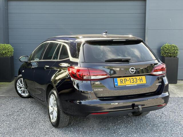 Opel ASTRA Sports Tourer 1.4 Business Executive ?2 Eigenaar?Camera?Navi?Trekhaakt?Carplay?Stoelverw?Stuurverw?Automaat?Dealer Onderhouden?Keyless?Clima?Cruise?Pdc V+A?Halfleder?Comfortstoelen?150pk?Rijstrooksensor?Dodehoeksensor?Elekt Stoelen?Lm velgen?N.A.P?Apk tot 03-2027