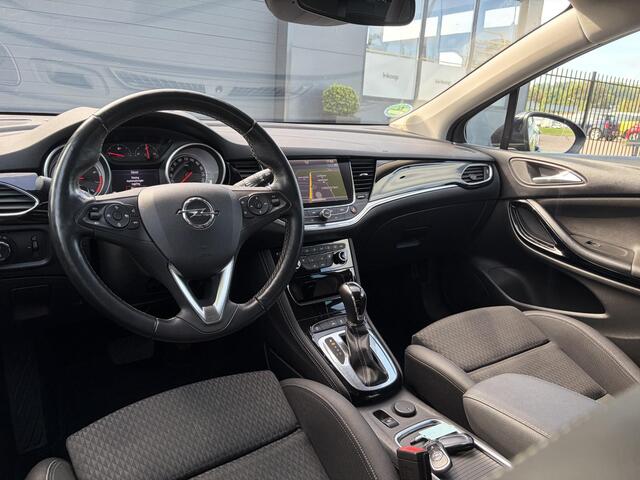 Opel ASTRA Sports Tourer 1.4 Business Executive ?2 Eigenaar?Camera?Navi?Trekhaakt?Carplay?Stoelverw?Stuurverw?Automaat?Dealer Onderhouden?Keyless?Clima?Cruise?Pdc V+A?Halfleder?Comfortstoelen?150pk?Rijstrooksensor?Dodehoeksensor?Elekt Stoelen?Lm velgen?N.A.P?Apk tot 03-2027