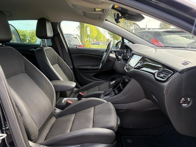 Opel ASTRA Sports Tourer 1.4 Business Executive ?2 Eigenaar?Camera?Navi?Trekhaakt?Carplay?Stoelverw?Stuurverw?Automaat?Dealer Onderhouden?Keyless?Clima?Cruise?Pdc V+A?Halfleder?Comfortstoelen?150pk?Rijstrooksensor?Dodehoeksensor?Elekt Stoelen?Lm velgen?N.A.P?Apk tot 03-2027